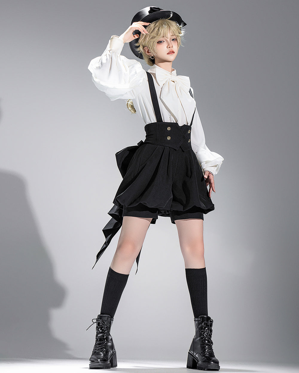 Stylish Black High-Waisted Suspender Shorts with Flared Skirt Overlay