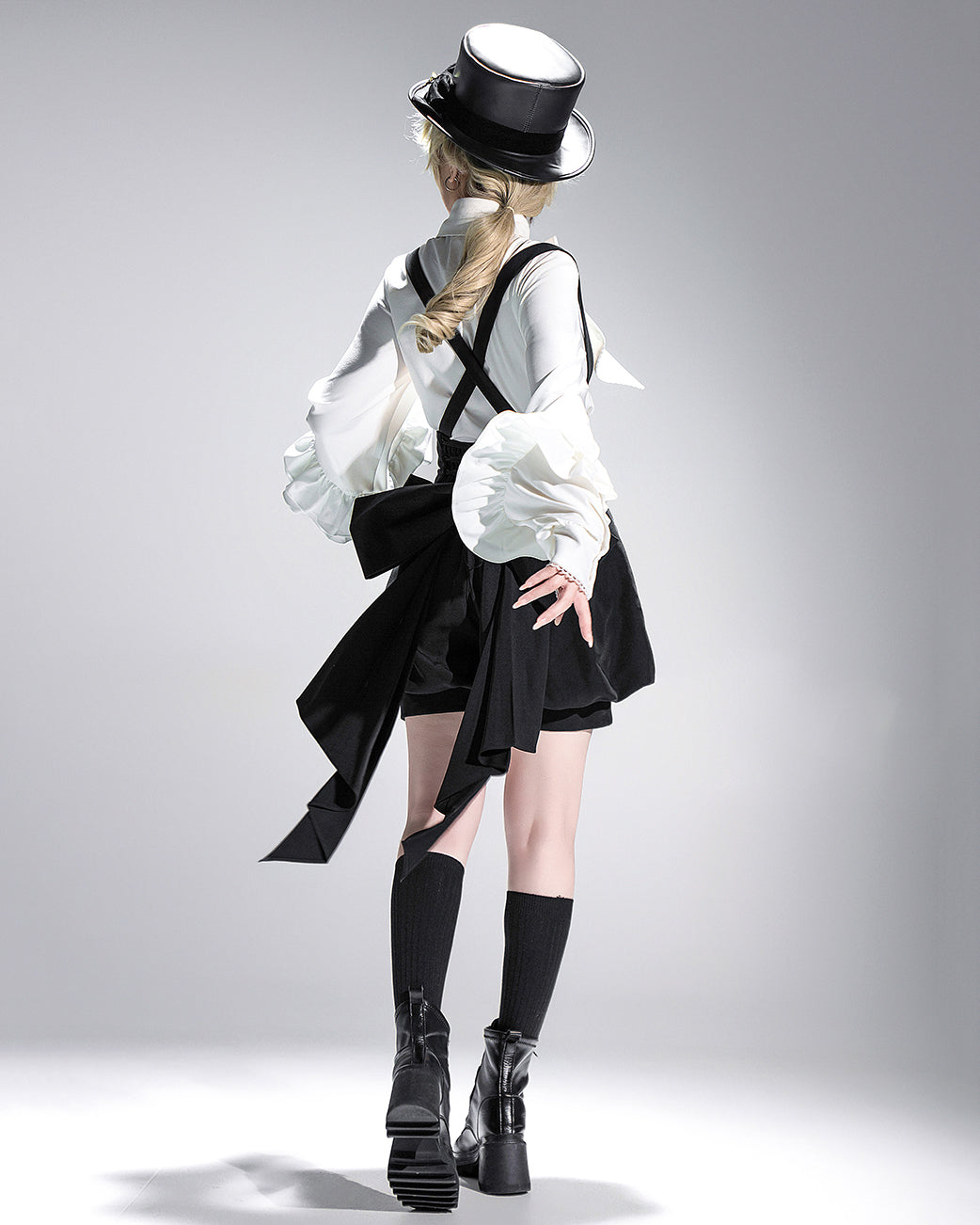 Stylish Black High-Waisted Suspender Shorts with Flared Skirt Overlay