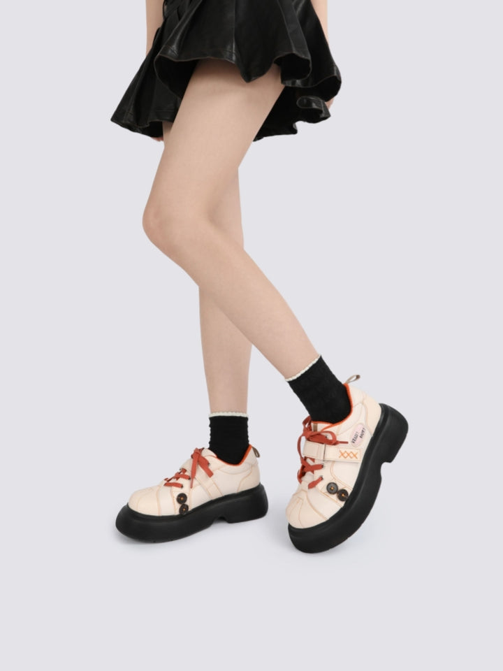 Orange Accents and Buttons Decorative Cream Sneakers
