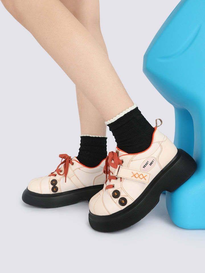 Orange Accents and Buttons Decorative Cream Sneakers