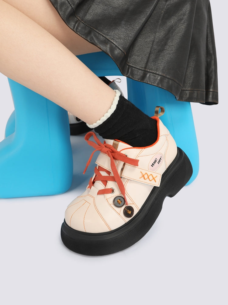 Orange Accents and Buttons Decorative Cream Sneakers